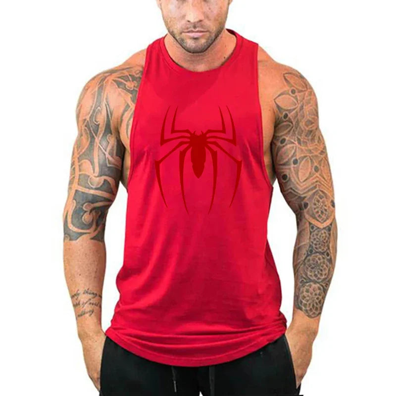 Red tank top with a spider logo worn by a person with tattoos on a white background