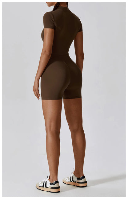 Person wearing a brown bodysuit on a light gray background