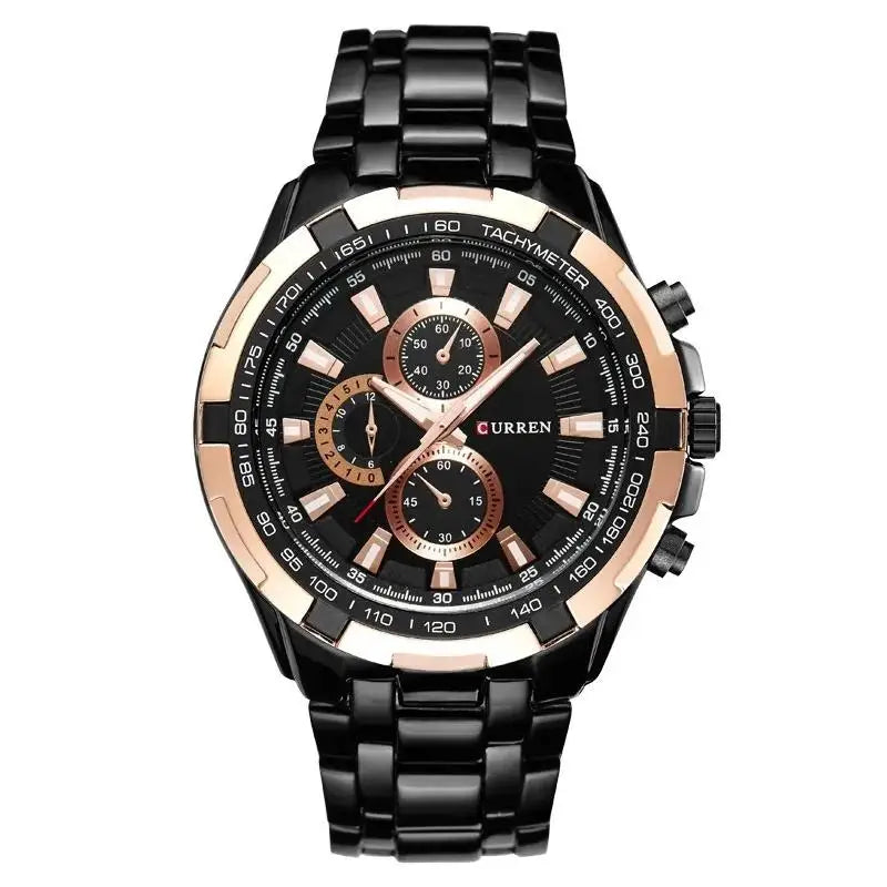 Black and rose gold watch with detailed face on a white background