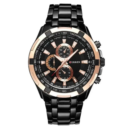 Black and rose gold watch with detailed face on a white background