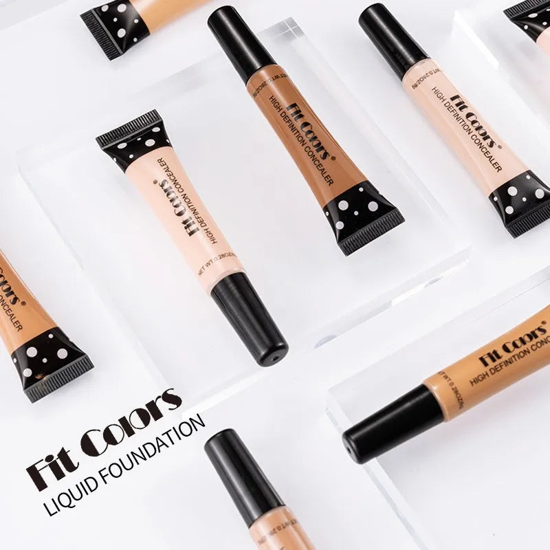 Multiple tubes of liquid foundation with black caps on a white background, featuring the brand 'Fit Colors'.