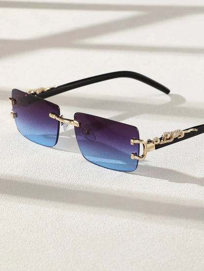 Sunglasses with gradient blue lenses and gold frames on a light background