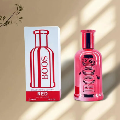 Pink perfume bottle and packaging with 'BOOS' branding on a beige background