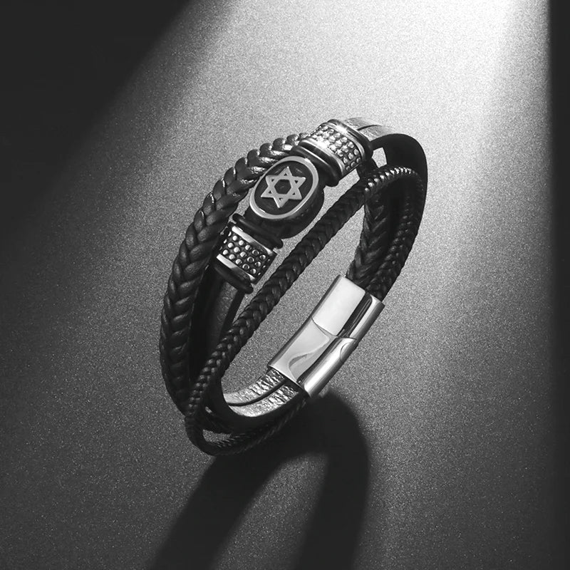 Black braided leather bracelet with metal accents on a dark surface
