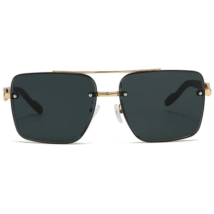 Sunglasses with gold frame and dark lenses on a white background
