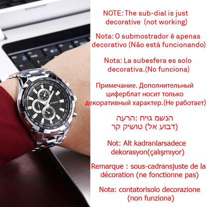 Wrist wearing a watch with decorative sub-dial, laptop in background