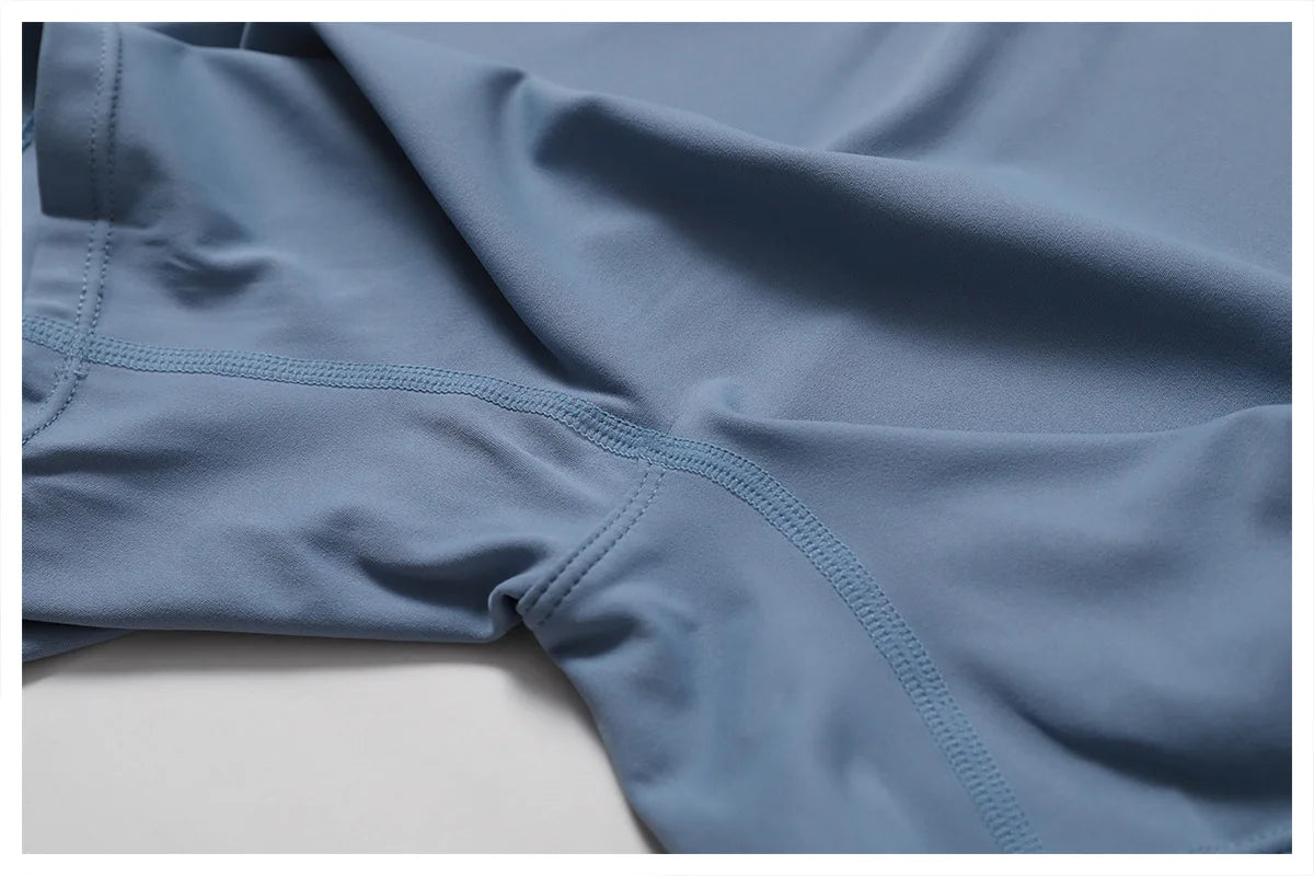 Close-up of blue athletic shorts on a light gray background
