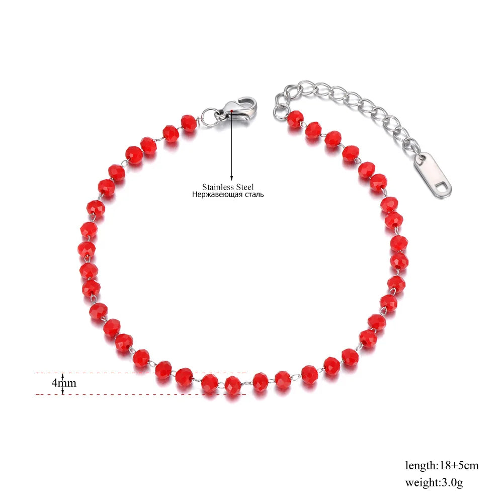 Red beaded bracelet with silver clasp on a white background