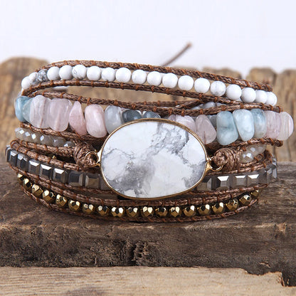 Multistrand bracelet with stones and beads on a wooden surface