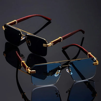 Sunglasses with gold frames and red accents on a reflective black surface