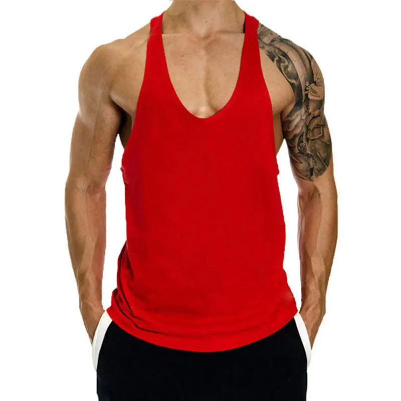 Red tank top worn by a person with tattoos on a white background