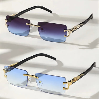 Pair of sunglasses with gold accents and blue gradient lenses on a white background