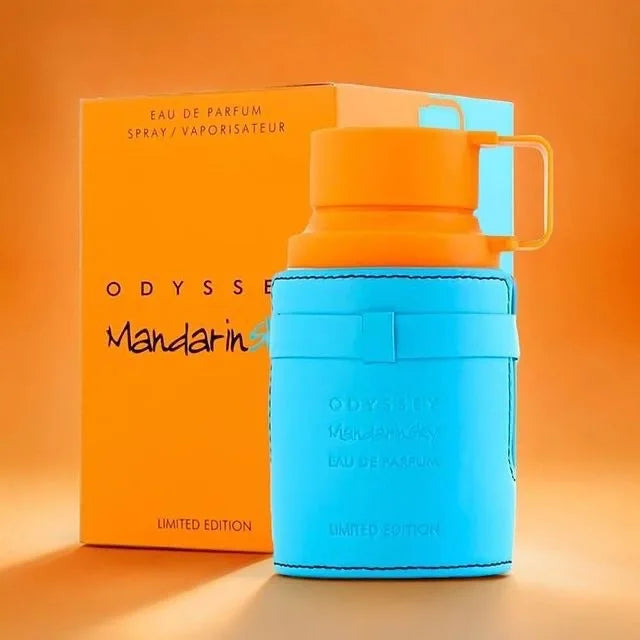 BlueOdysse mandarin perfume bottle with orange box on an orange background