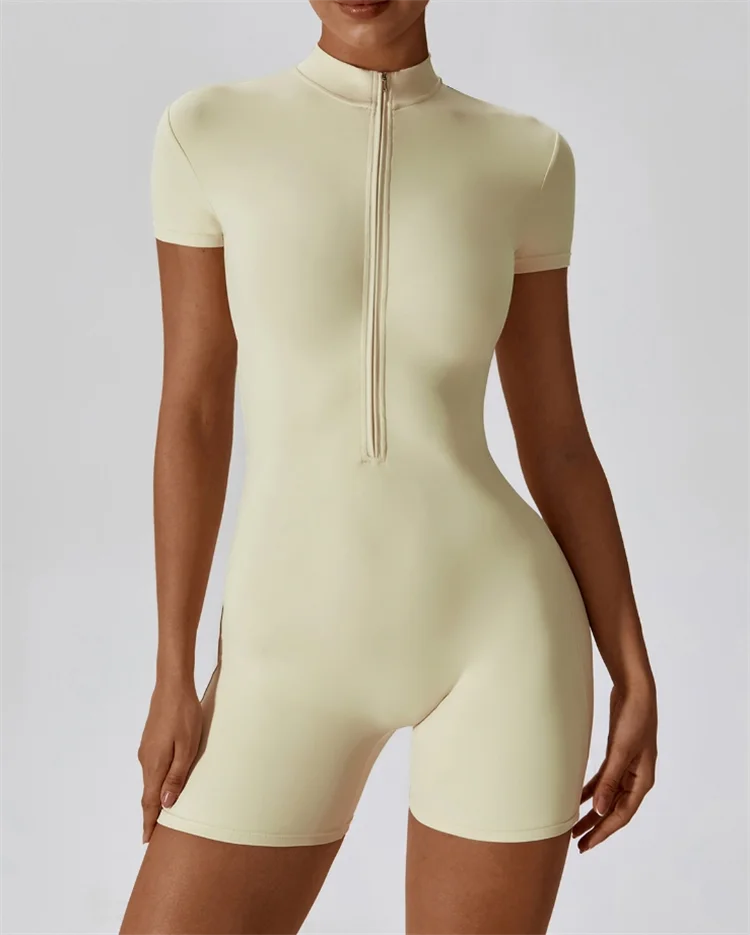Beige bodysuit worn by a model on a plain background