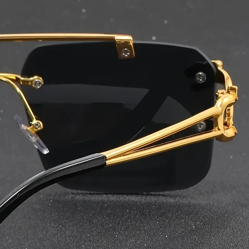 Sunglasses with gold frame and black lenses on a dark background