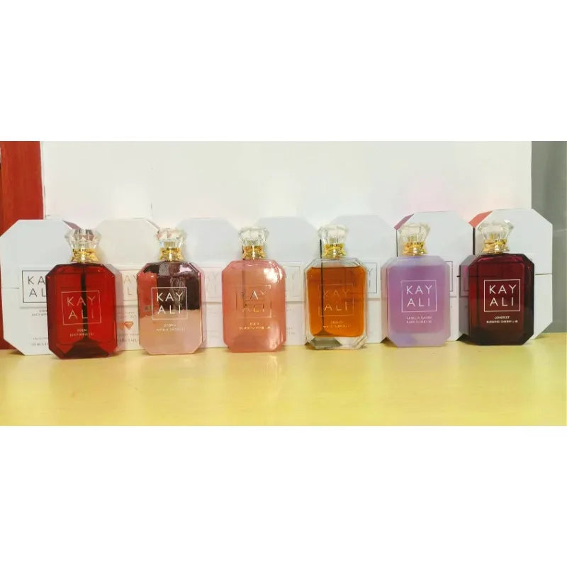 Row of KAYALI perfume bottles on a white background