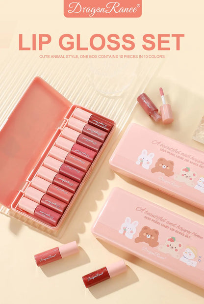 Lip gloss set with cute animal design packaging on a light background
