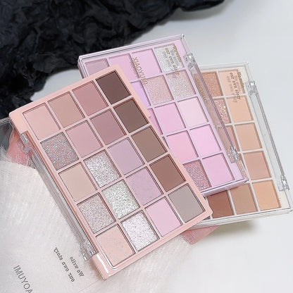 Makeup palettes with a variety of colors on a light background