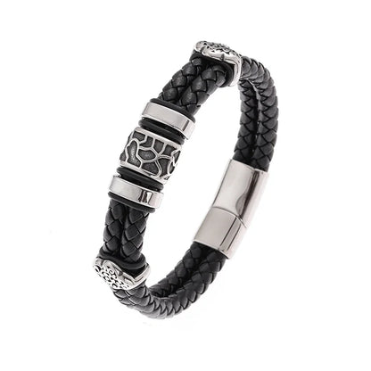 Black braided leather bracelet with silver metal accents on a white background