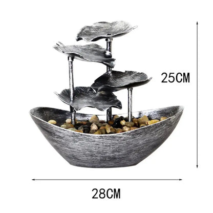 Decorative water fountain with leaf designs and dimensions labeled on a white background