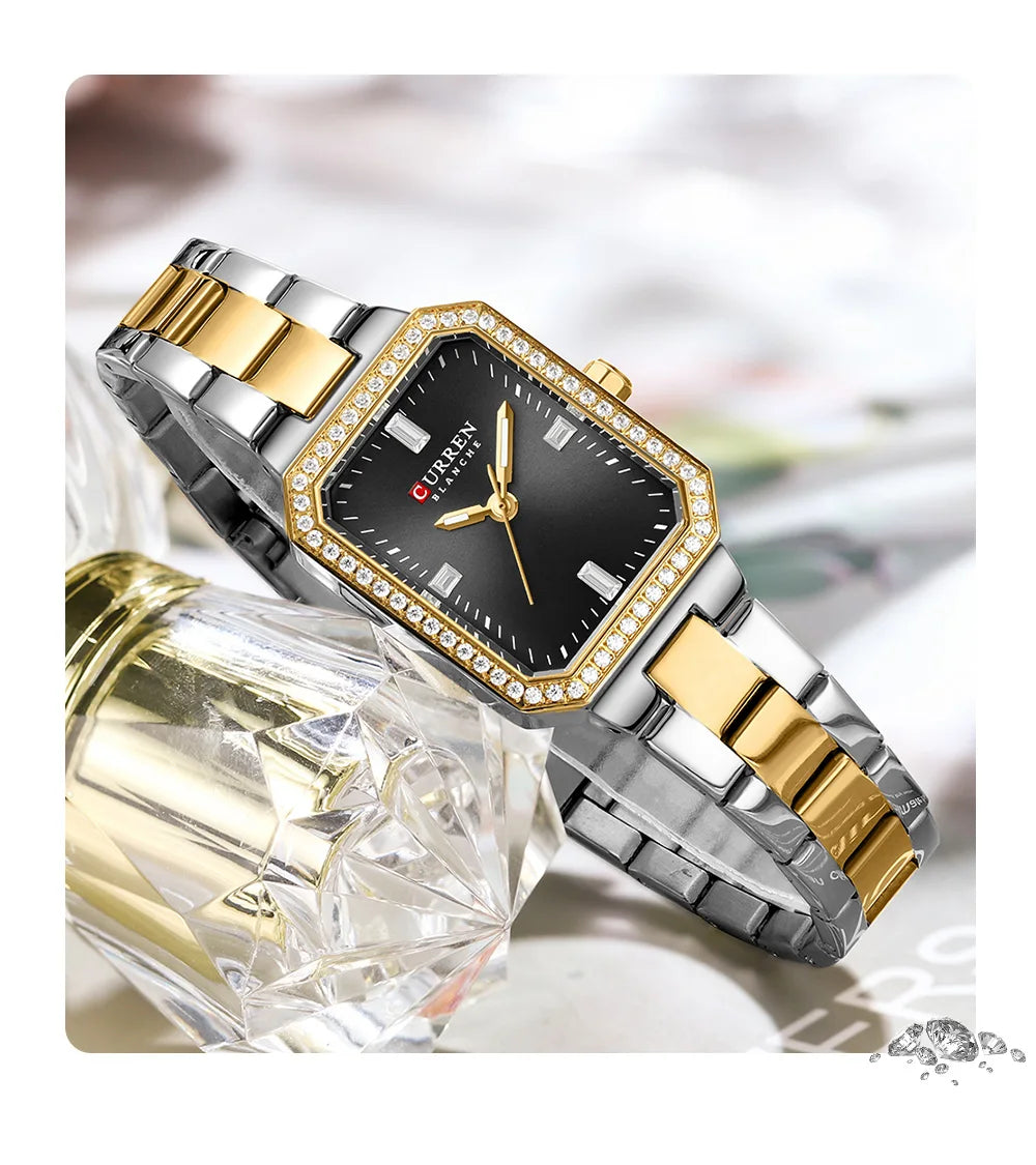 Luxury watch with gold and silver band on a white background