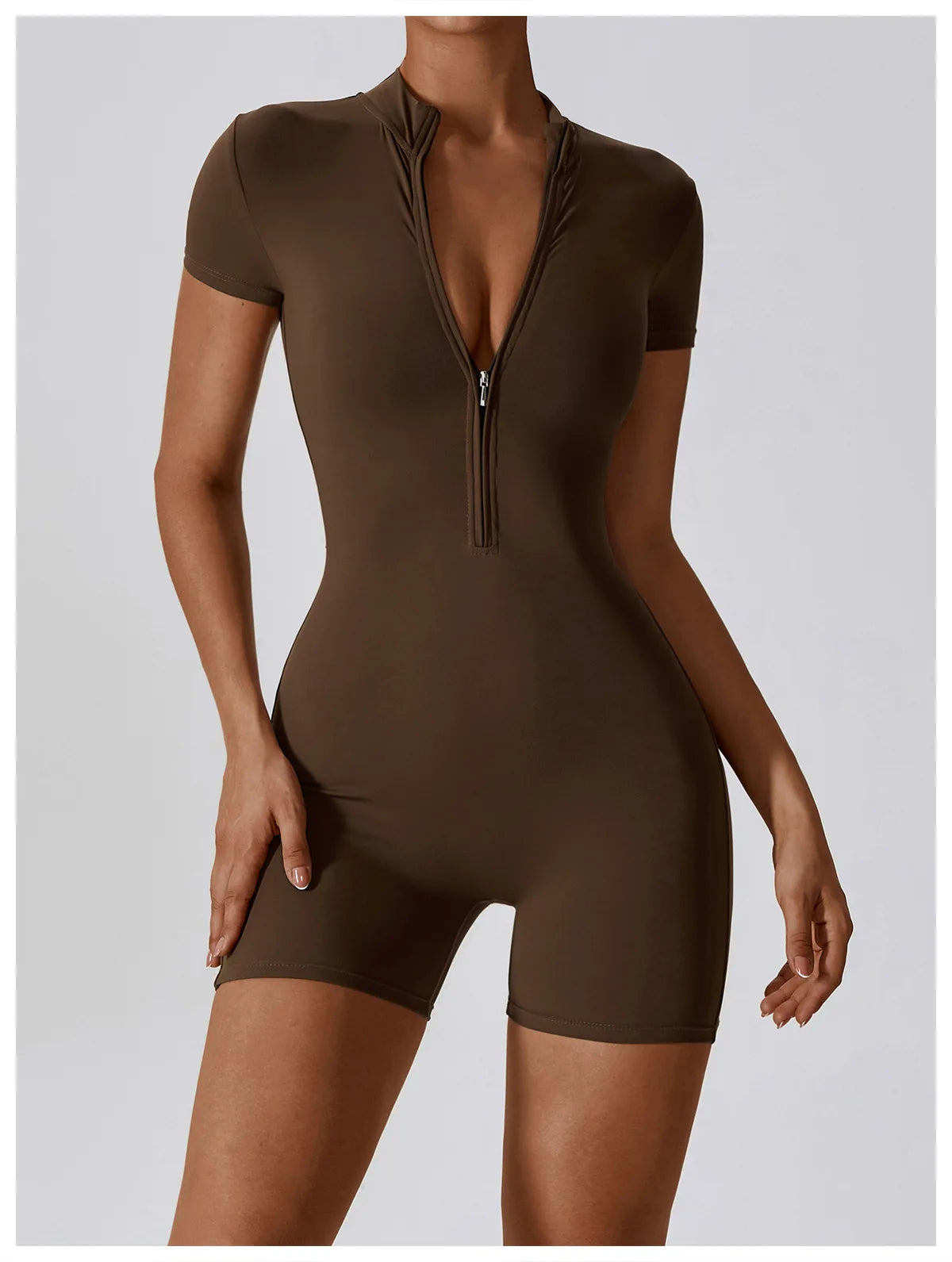 Brown bodysuit with zipper detail on a plain background