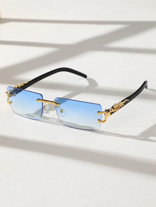 Sunglasses with blue gradient lenses and gold frames on a white background