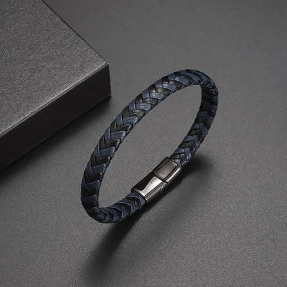 Black braided leather bracelet with a metal clasp on a gray background