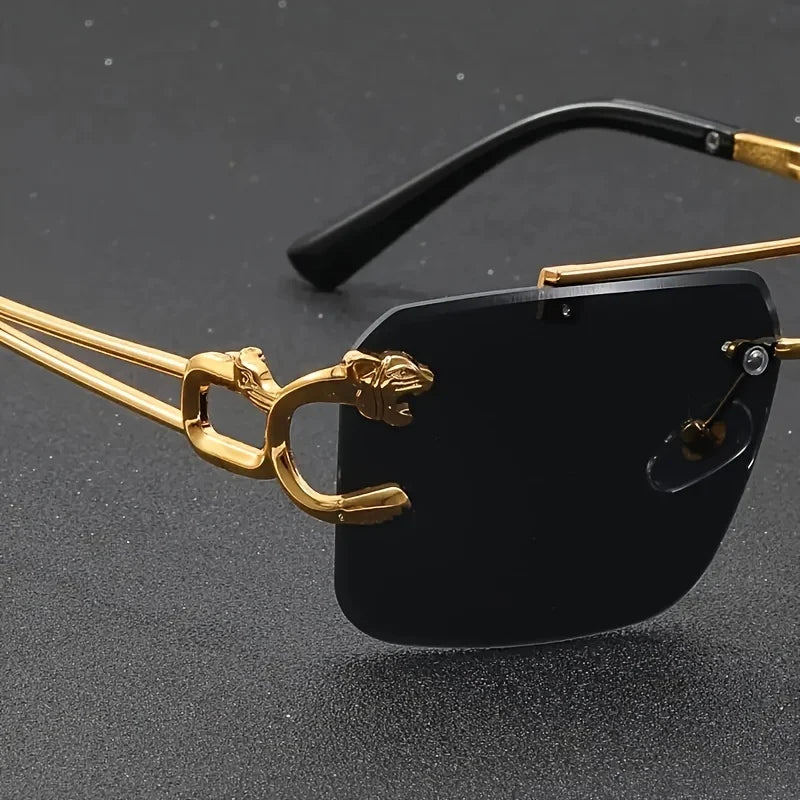 Sunglasses with gold frame and black lenses on a dark background