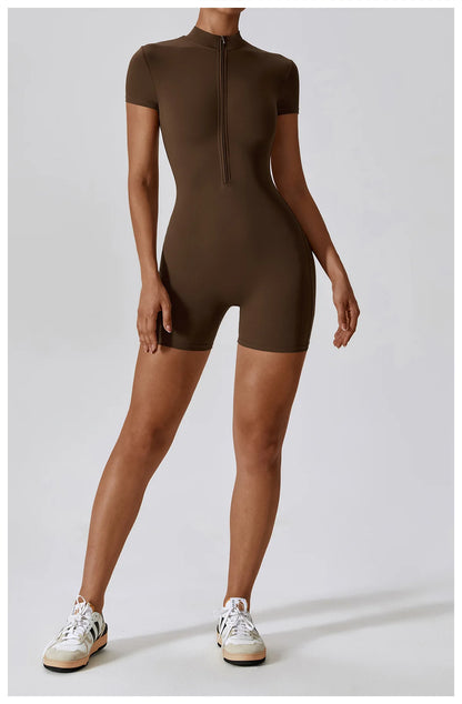 Person wearing a brown bodysuit on a white background