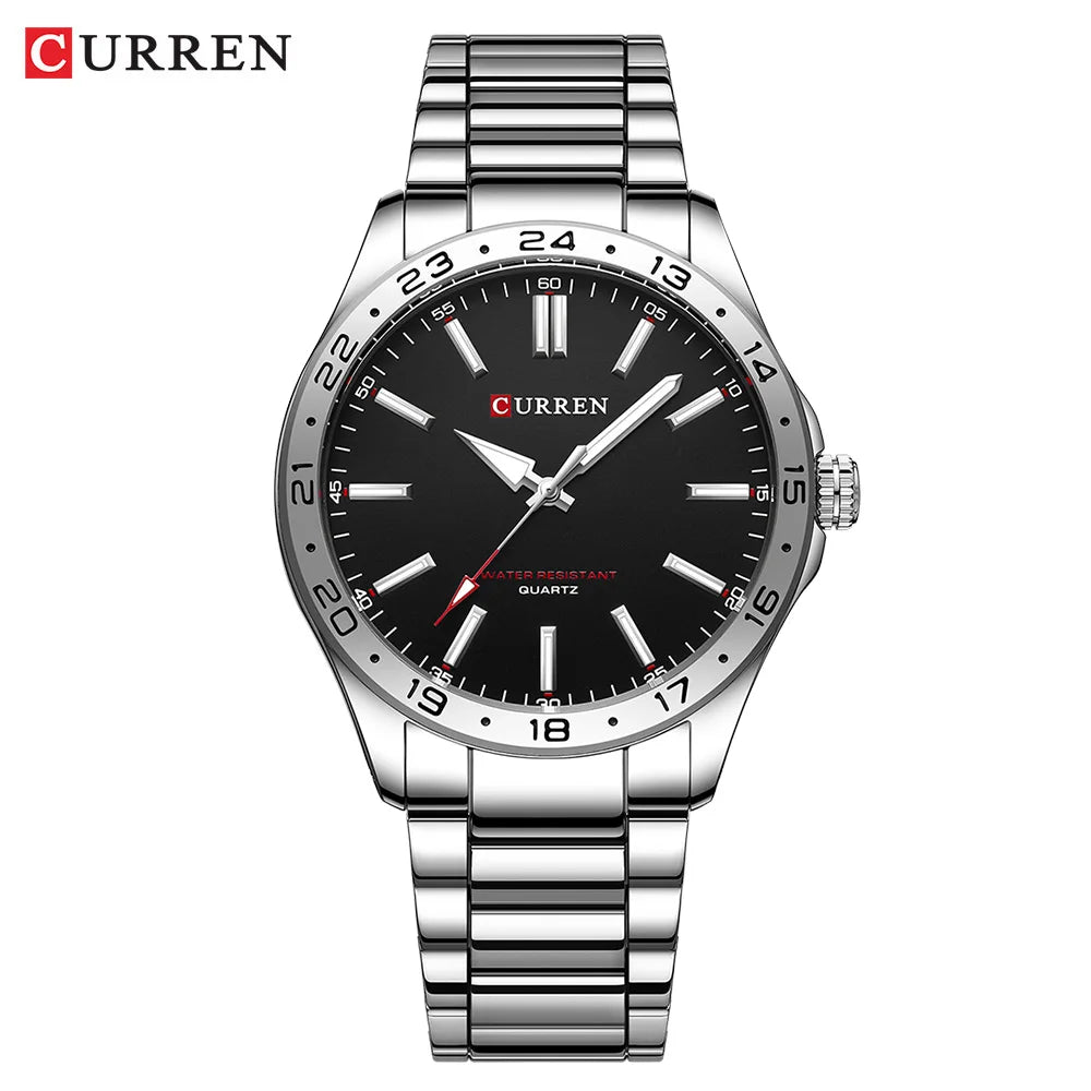 Curren watch with black dial and silver metal strap on a white background