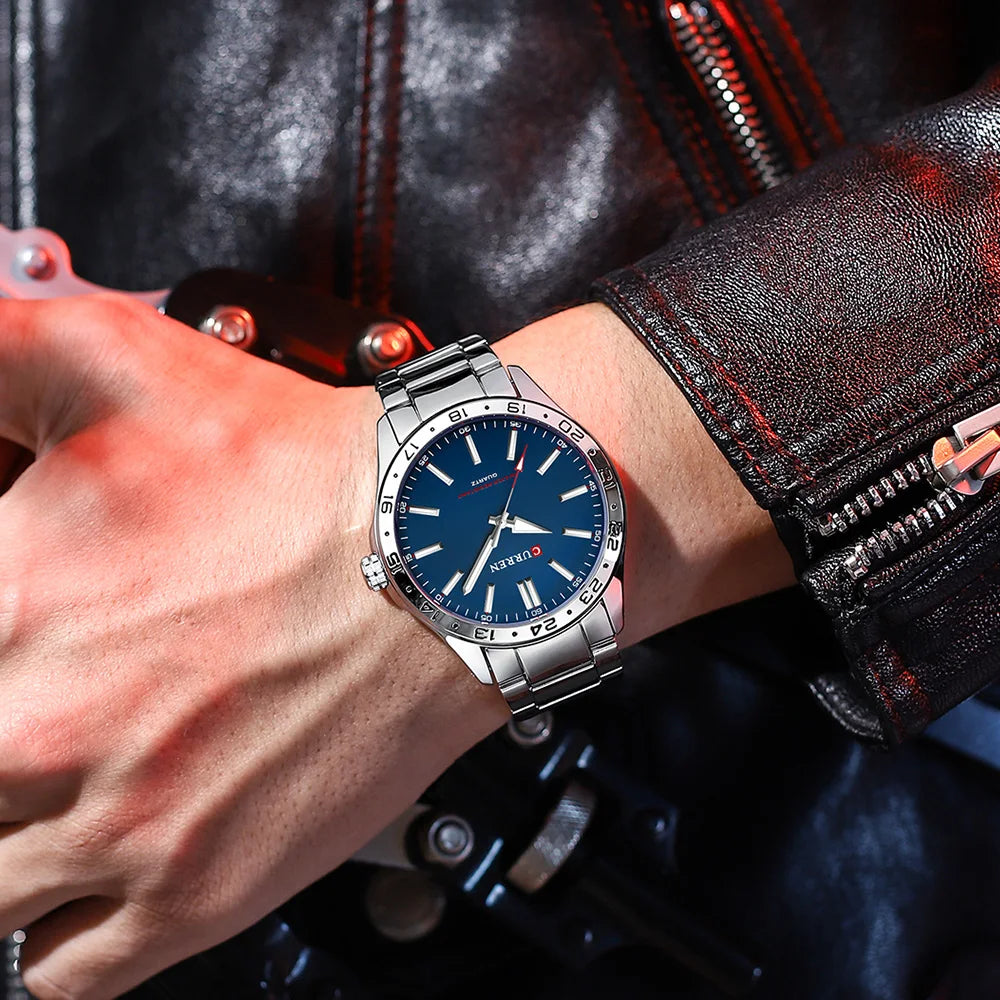 Person wearing a blue watch with a leather jacket background