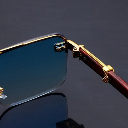 Gold-framed sunglasses with a dark background