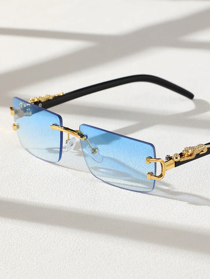 Sunglasses with blue lenses and gold frames on a light background