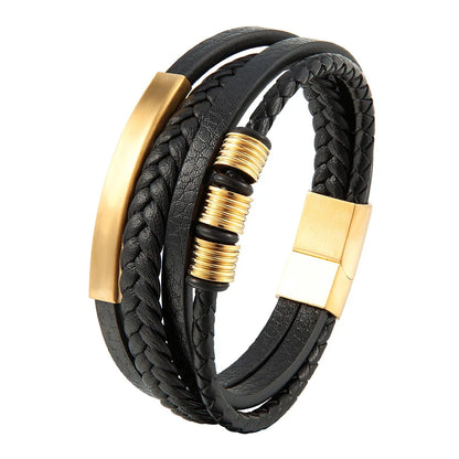 Black braided leather bracelet with gold accents on a white background