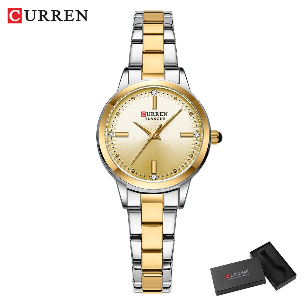 Gold and silver Curren watch with a matching box on a white background