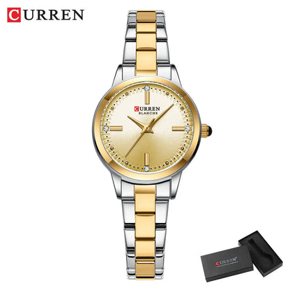 Gold and silver Curren watch with a matching box on a white background