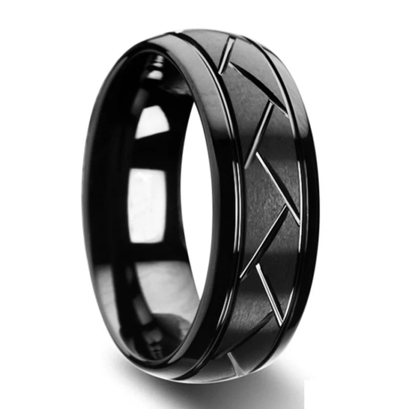 Black tungsten ring with geometric design on a white background