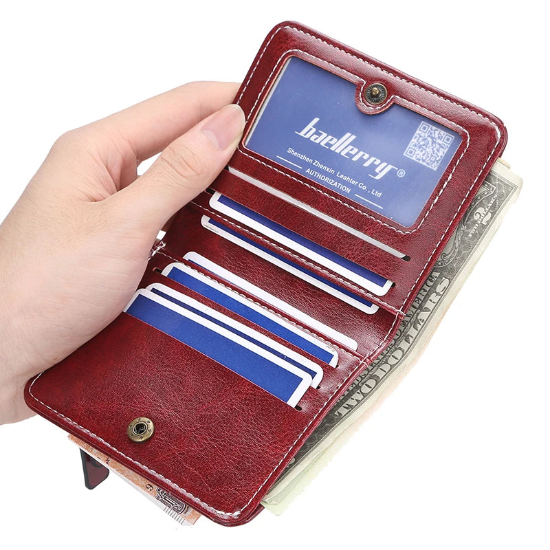 Red wallet with card slots held by a hand, brand 'baellerry' visible