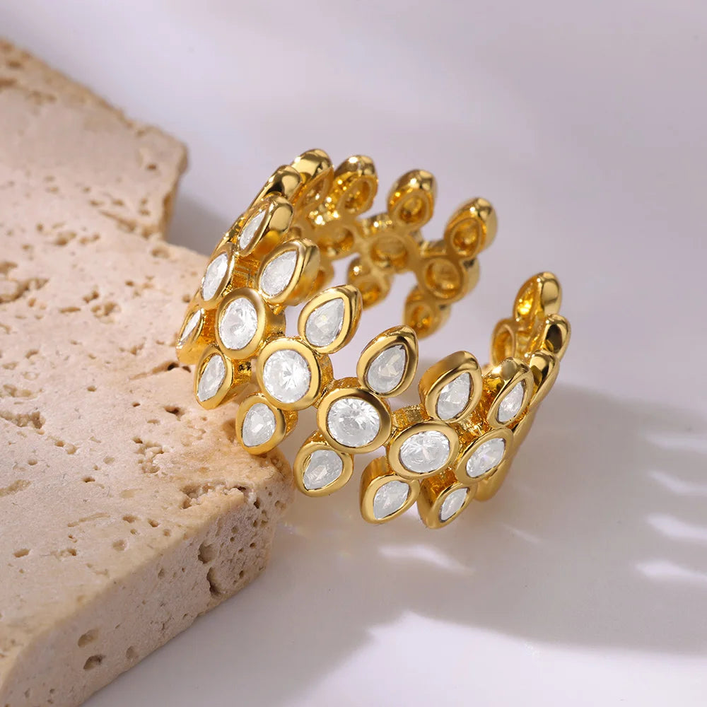 Gold bracelet with white stones on a textured surface