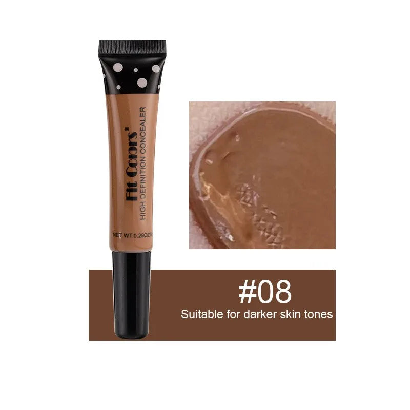 Concealer tube with applicator and color swatch, suitable for darker skin tones.