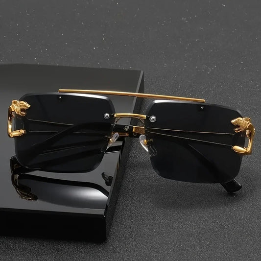 Black sunglasses with gold accents on a black stand against a dark background