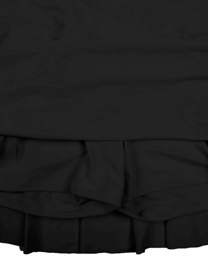 Black skirt with ruffled layers on a white background
