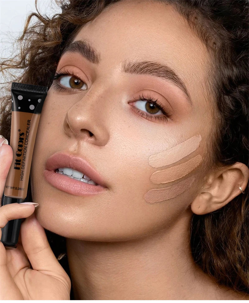 Woman applying foundation to her face with a makeup brush