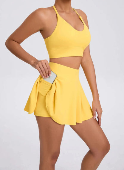 Yellow two-piece outfit with a skirt and top on a white background