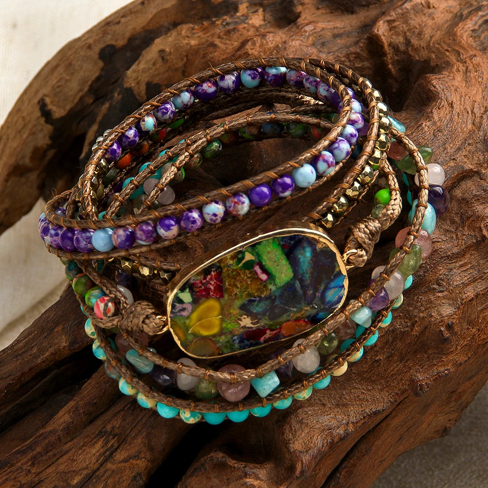 Stack of colorful beaded bracelets on a wooden surface