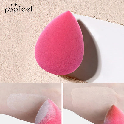 Pink makeup sponge with application examples on a beige background, featuring the popfeel brand.