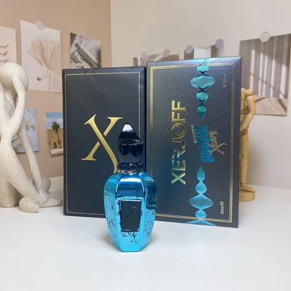 Blue perfume bottle with Xerjoff packaging in the background