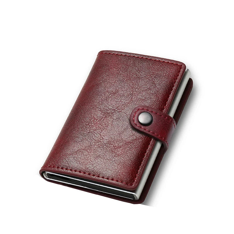 Red leather wallet with a metallic button on a white background