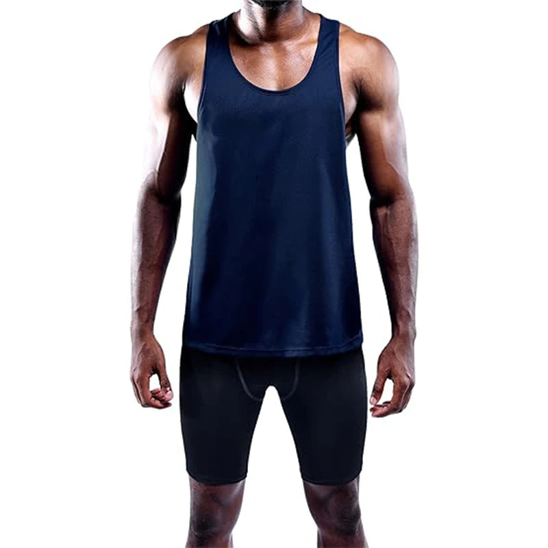 Person wearing a navy tank top and black shorts on a white background